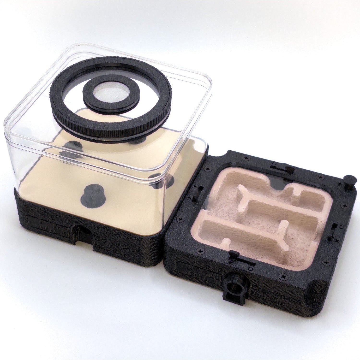 Modular FlexGrid ant formicarium: a black outworld with clear lid beside a black ant nest with dusty red gypsum.